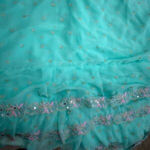 Elegant Tuquoise Embroidered Tiered Saree